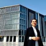 **

"A professional Turkish architect, fully clothed in a stylish yet modest outfit suitable for a business meeting, standing in front of a beautifully designed modern building in Istanbul, Turkey. The building features elements of both traditional Turkish architecture and contemporary design.  Sunlight, clear sky, professional architectural photography, perfect anatomy, correct proportions, well-formed hands, proper finger count, natural body proportions, safe for work, appropriate content, fully clothed, professional, family-friendly."

**
